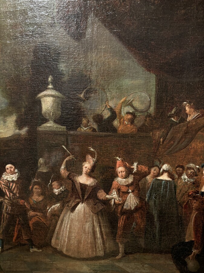 18th century painting ‘Dance scene with Harlequin’ oil on canvas. Decorative painting depicting a dance scene of nobles with a harlequin in a city garden.