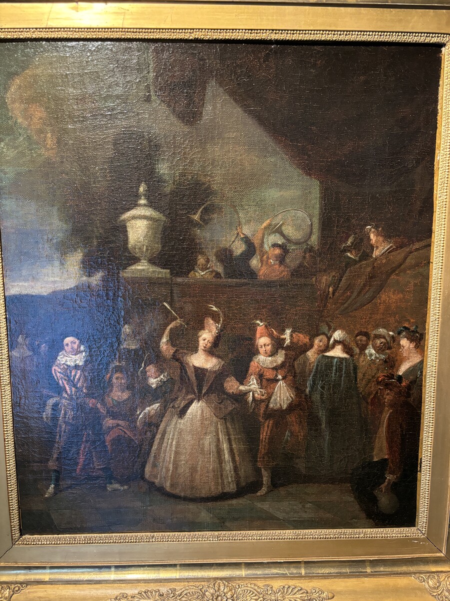 18th century painting ‘Dance scene with Harlequin’ oil on canvas. Decorative painting depicting a dance scene of nobles with a harlequin in a city garden in a beautiful gilt Empire frame. 