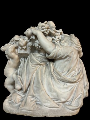 19th century Carrara marble sculpture of a woman and putti carrying baskets of fruit. A Renaissance decorative marble sculpture of a woman and putti carrying baskets of fruit. The sculpture is signed by Levasseur ( Paris 1853-1934 )