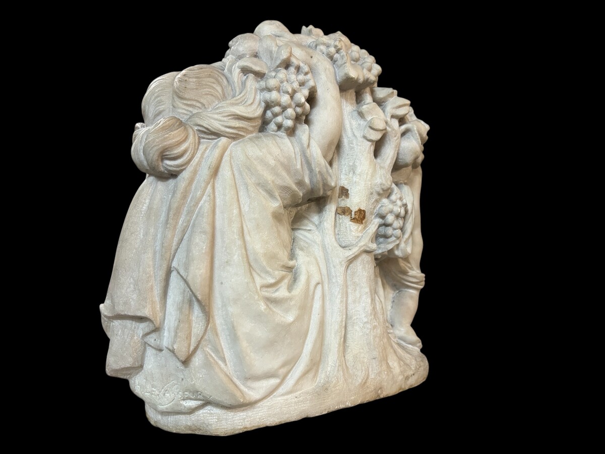 19th century Carrara marble sculpture of a woman and putti carrying baskets of fruit. A Renaissance decorative marble sculpture of a woman and putti carrying baskets of fruit. The sculpture is signed by Levasseur ( Paris 1853-1934 )