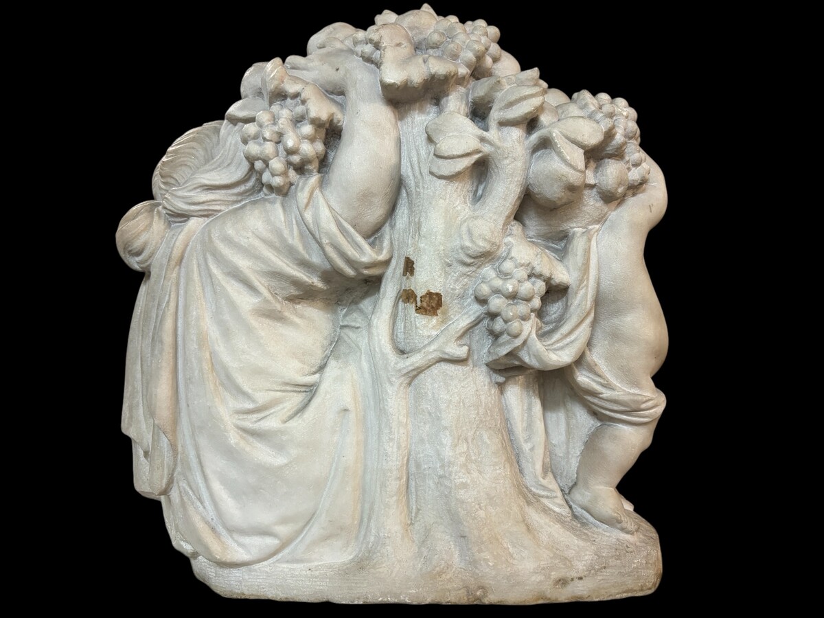 19th century Carrara marble sculpture of a woman and putti carrying baskets of fruit. A Renaissance decorative marble sculpture of a woman and putti carrying baskets of fruit. The sculpture is signed by Levasseur ( Paris 1853-1934 )