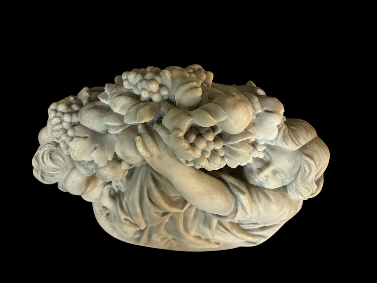 19th century Carrara marble sculpture of a woman and putti carrying baskets of fruit. A Renaissance decorative marble sculpture of a woman and putti carrying baskets of fruit. The sculpture is signed by Levasseur ( Paris 1853-1934 )