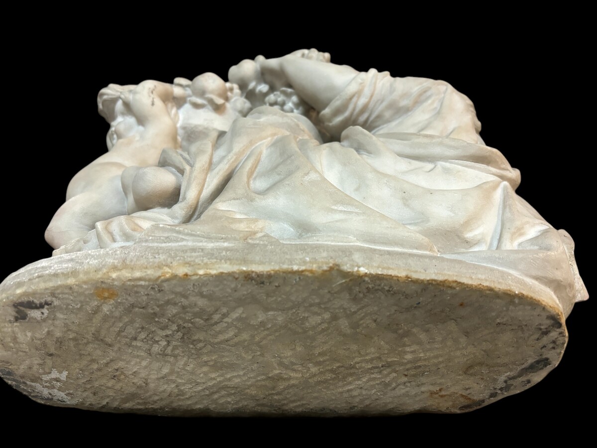 19th century Carrara marble sculpture of a woman and putti carrying baskets of fruit. A Renaissance decorative marble sculpture of a woman and putti carrying baskets of fruit. The sculpture is signed by Levasseur ( Paris 1853-1934 )