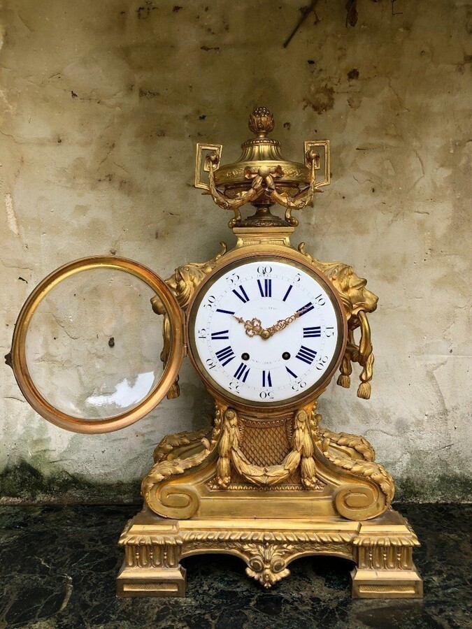 A Large Gilt Bronze LXVI Style Mantelpiece Paris, 19th Century. The Clock And The Candelabras Are Gilded With Matt And Bright Gold. Clock Signed By G.Philippe, Palais Royal 66 & 67 In Paris. Dimensions Clock: 68 Cm High, 42 Cm Wide And 24 Cm Deep.