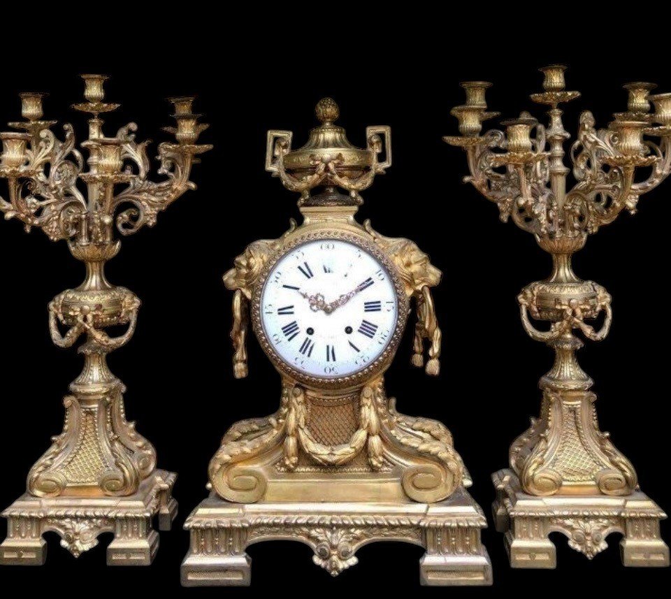 A Large Gilt Bronze LXVI Style Mantelpiece Paris, 19th Century. The Clock And The Candelabras Are Gilded With Matt And Bright Gold. Clock Signed By G.Philippe, Palais Royal 66 & 67 In Paris. Dimensions Clock: 68 Cm High, 42 Cm Wide And 24 Cm Deep.