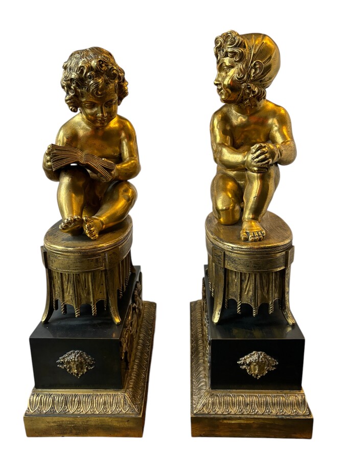 A pair of early 19th century gilt and patinated bronze sculptures. Quality bronzes with very fine details. Both sculptures are in very good condition with signs of use to the gilding