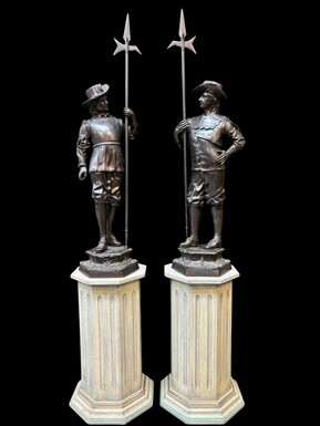 A pair of large gatekeepers / soldiers in bronze 20th century Decorative sculptures in bronze with signature E.Picault  Dimensions : Height : 101 / 135 cm Width : 39 cm Bronze base : 32 x 30 cm Wooden pedestals pictured are also available for sale if requ