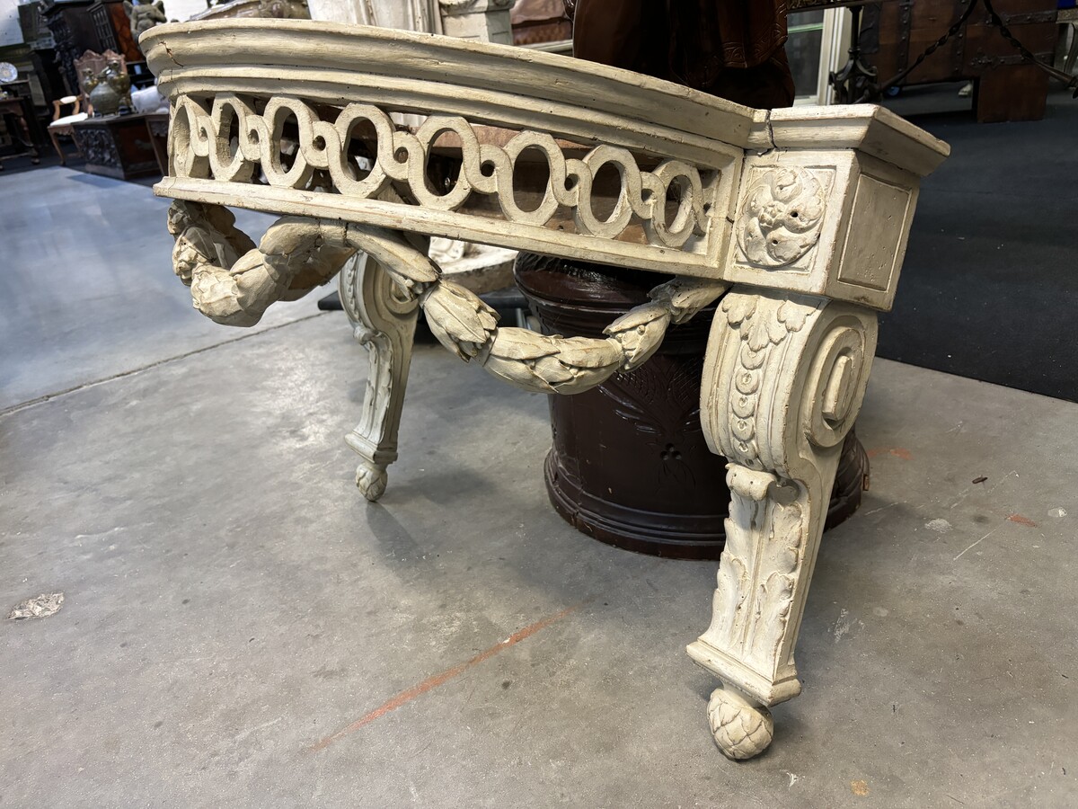 Beautiful Louis XVI style wall console in 18th century painted wood. Very decorative curved console in the Louis XVI style, decorated with girlandes with its original white marble. Dimensions : Height : 62 cm Width : 94,5 cm Depth : 51 cm 