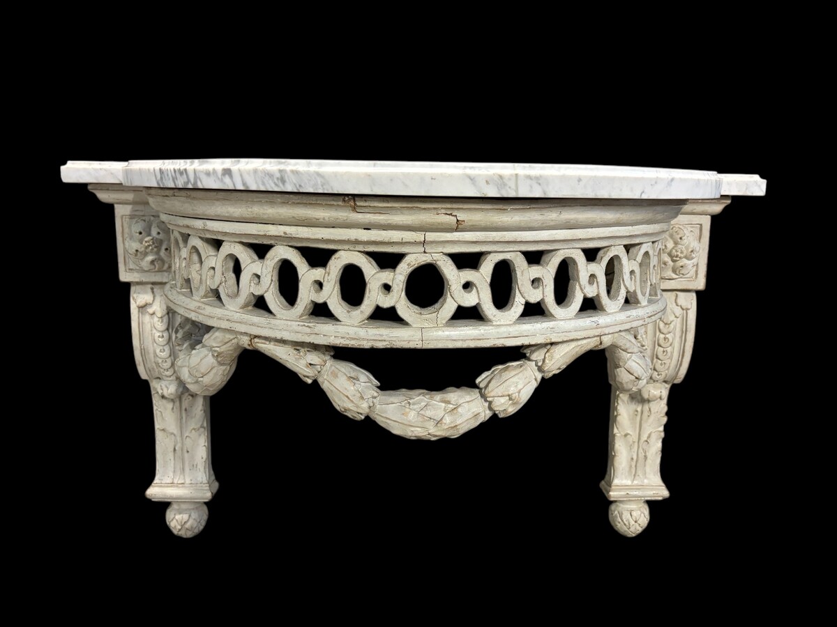 Beautiful Louis XVI style wall console in 18th century painted wood. Very decorative curved console in the Louis XVI style, decorated with girlandes with its original white marble. Dimensions : Height : 62 cm Width : 94,5 cm Depth : 51 cm 