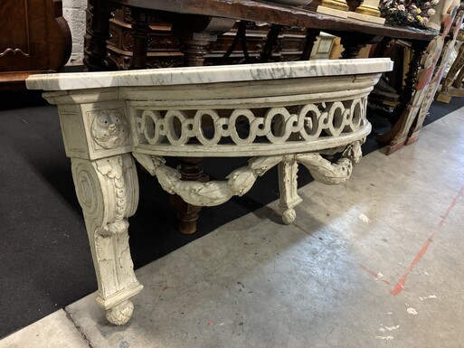 Beautiful Louis XVI style wall console in 18th century painted wood.  Very decorative curved console in the Louis XVI style, decorated with girlandes with its original white marble. Dimensions : Height : 62 cm Width : 94,5 cm Depth : 51 cm In good conditi