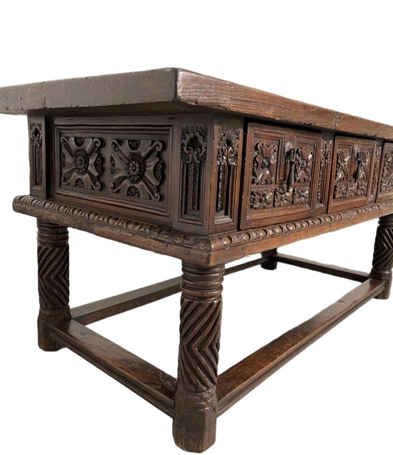 Beautiful Spanish table in Chestnut wood 17th century. Large sturdy table finished on 4 sides with beautiful wood carved decorations and fitted with 3 large drawers at the front. Beautiful thick top of 5 cm. Table in good condition