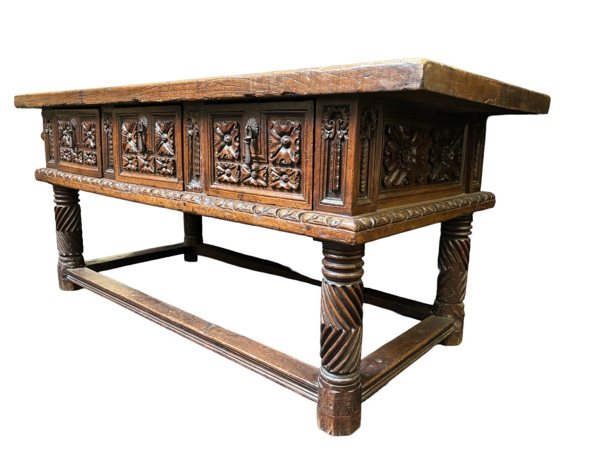 Beautiful Spanish table in Chestnut wood 17th century. Large sturdy table finished on 4 sides with beautiful wood carved decorations and fitted with 3 large drawers at the front. Beautiful thick top of 5 cm. Table in good condition