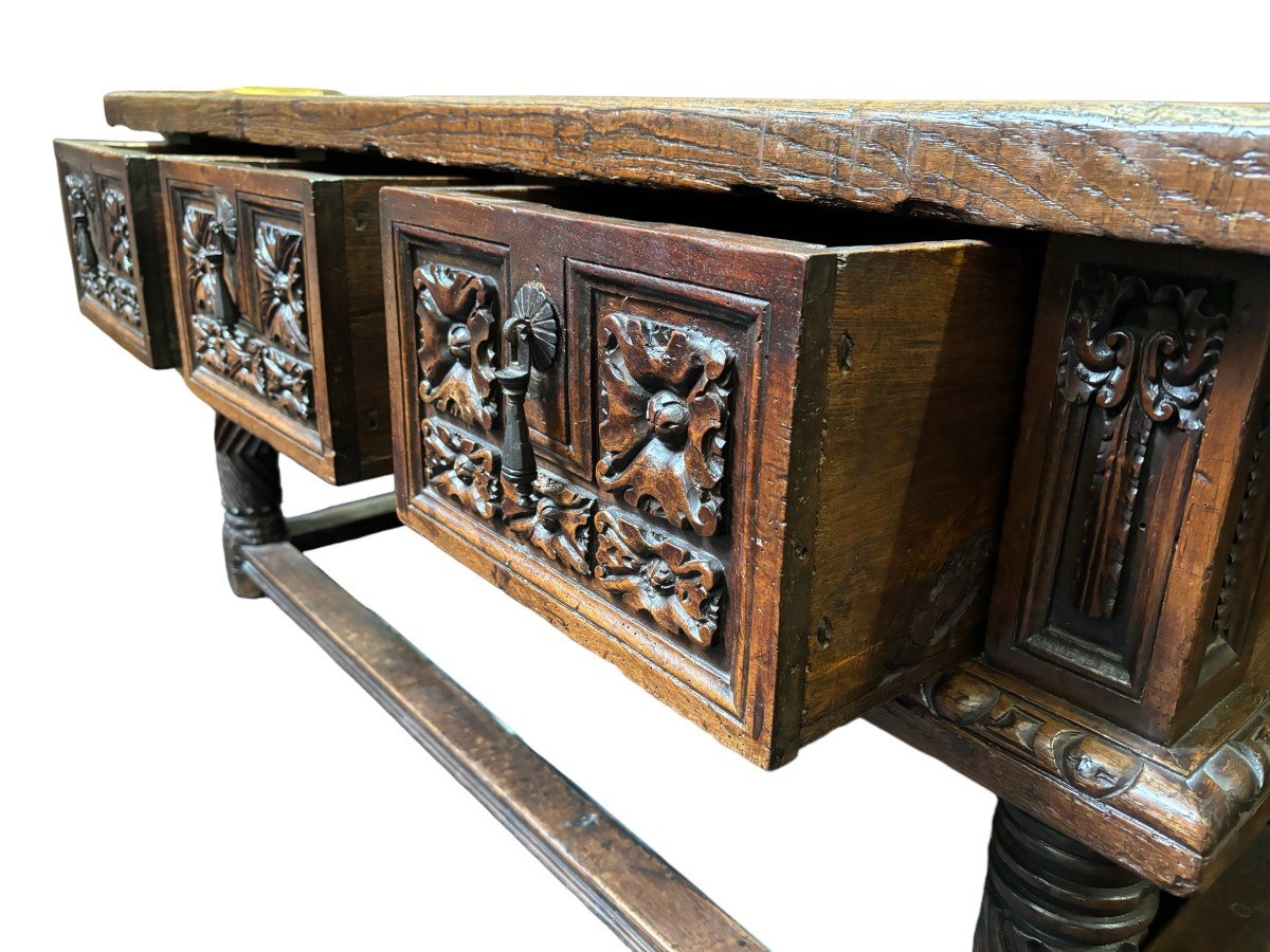 Beautiful Spanish table in Chestnut wood 17th century. Large sturdy table finished on 4 sides with beautiful wood carved decorations and fitted with 3 large drawers at the front. Beautiful thick top of 5 cm. Table in good condition