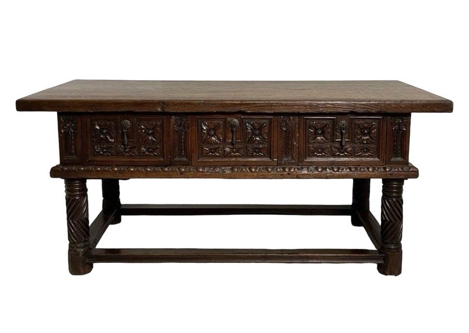 Beautiful Spanish table in Chestnut wood 17th century. Large sturdy table finished on 4 sides with beautiful wood carved decorations and fitted with 3 large drawers at the front. Beautiful thick top of 5 cm. Table in good condition