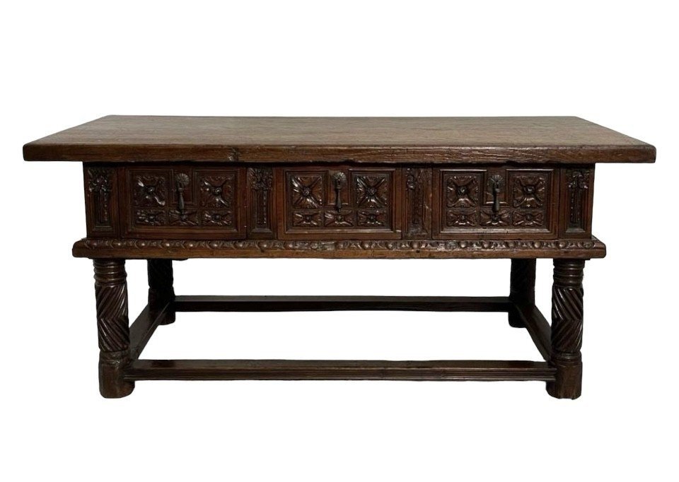 Beautiful Spanish table in Chestnut wood 17th century. Large sturdy table finished on 4 sides with beautiful wood carved decorations and fitted with 3 large drawers at the front. Beautiful thick top of 5 cm. Table in good condition