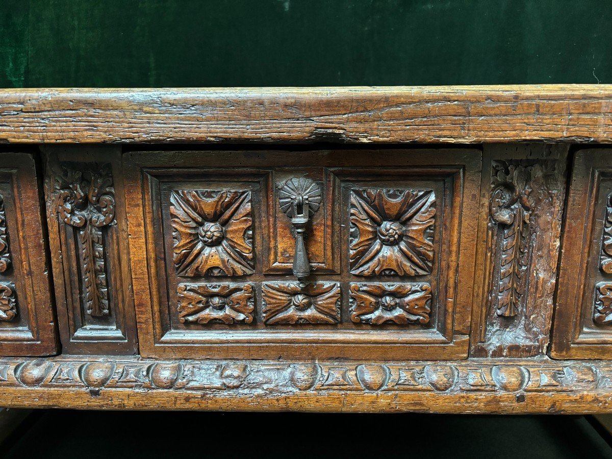 Beautiful Spanish table in Chestnut wood 17th century. Large sturdy table finished on 4 sides with beautiful wood carved decorations and fitted with 3 large drawers at the front. Beautiful thick top of 5 cm. Table in good condition