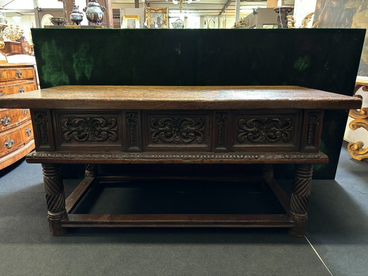 Beautiful Spanish table in Chestnut wood 17th century. Large sturdy table finished on 4 sides with beautiful wood carved decorations and fitted with 3 large drawers at the front. Beautiful thick top of 5 cm. Table in good condition