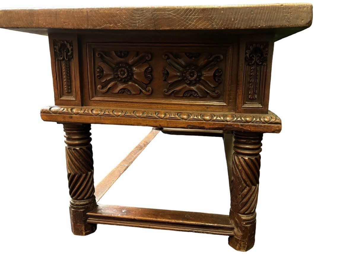 Beautiful Spanish table in Chestnut wood 17th century. Large sturdy table finished on 4 sides with beautiful wood carved decorations and fitted with 3 large drawers at the front. Beautiful thick top of 5 cm. Table in good condition