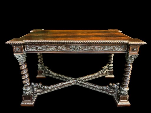 Center table / desk in rosewood 19thC. Very good quality and finely carved table, with 4 twisted columns with Corinthian capitals, figures, carvings and decorations all around. The desk has a large drawer and the interior is in solid lemon wood. 