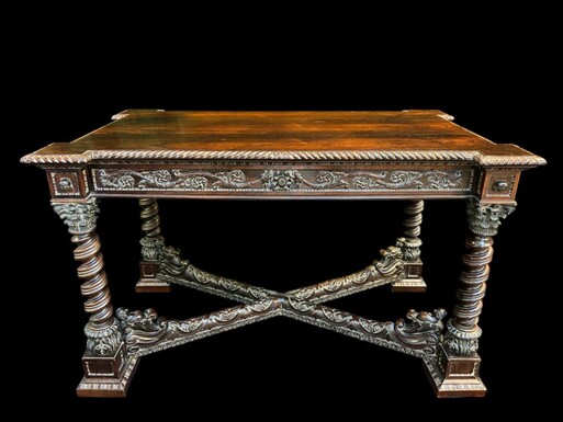 Center table / desk in rosewood 19thC. Very good quality and finely carved table, with 4 twisted columns with Corinthian capitals, figures, carvings and decorations all around. The desk has a large drawer and the interior is in solid lemon wood.