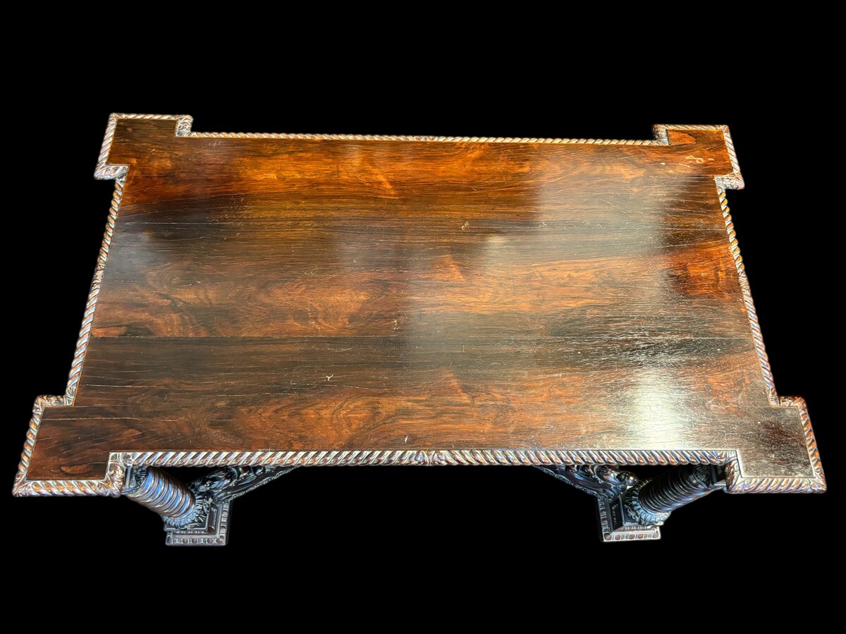 Center table / desk in rosewood 19thC. Very good quality and finely carved table, with 4 twisted columns with Corinthian capitals, figures, carvings and decorations all around. The desk has a large drawer and the interior is in solid lemon wood. 