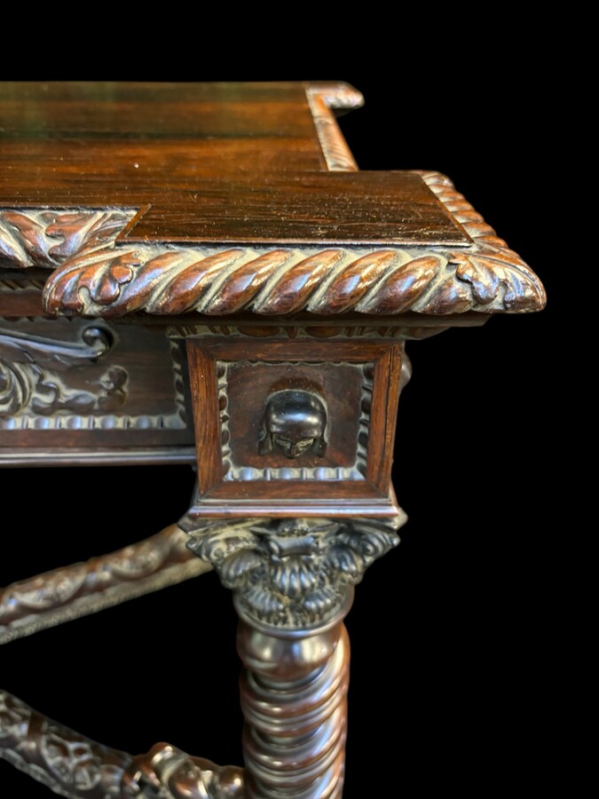 Center table / desk in rosewood 19thC. Very good quality and finely carved table, with 4 twisted columns with Corinthian capitals, figures, carvings and decorations all around. The desk has a large drawer and the interior is in solid lemon wood. 