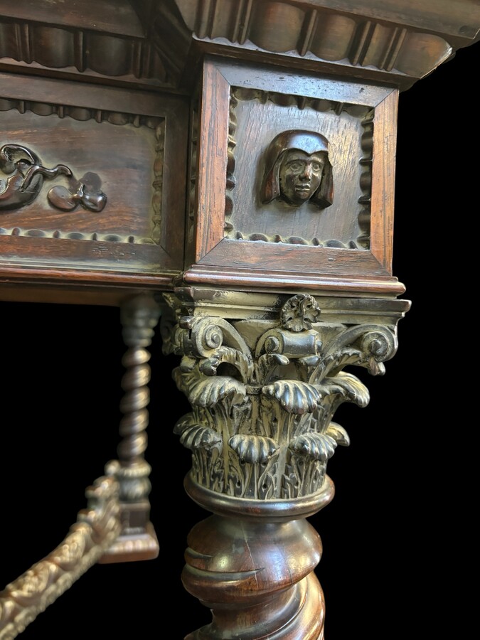 Center table / desk in rosewood 19thC. Very good quality and finely carved table, with 4 twisted columns with Corinthian capitals, figures, carvings and decorations all around. The desk has a large drawer and the interior is in solid lemon wood. 