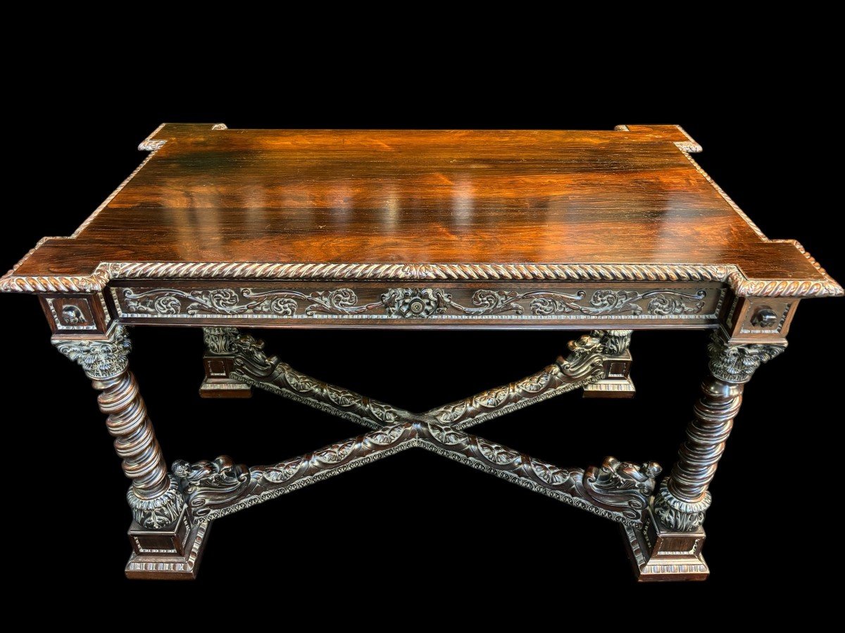 Center table / desk in rosewood 19thC. Very good quality and finely carved table, with 4 twisted columns with Corinthian capitals, figures, carvings and decorations all around. The desk has a large drawer and the interior is in solid lemon wood.