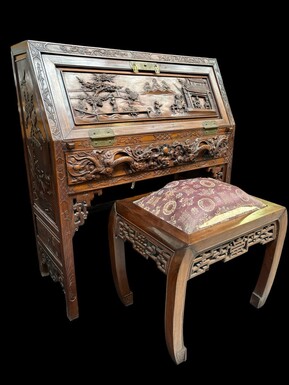 Charming desk / secretaire with footstool , China circa 1900 Finely sculpted desk with Oriental representations and Chinese dragons. Desk in bois de rose fitted with a flap and a large drawer underneath. Matching footstool with silk fabric ( exchangeable