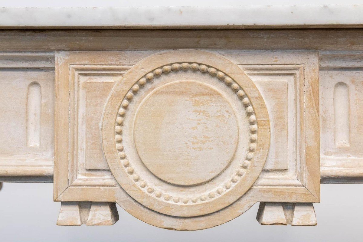 Decorative console of sculpted wood Louis XVI style late 19th century. Model with iconic columns minor damages and crack in marble top. Dimensions : Width: 125 cm Height: 87 cm Depth: 65,5 cm