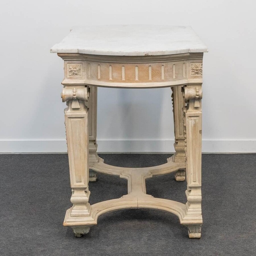 Decorative console of sculpted wood Louis XVI style late 19th century. Model with iconic columns minor damages and crack in marble top. Dimensions : Width: 125 cm Height: 87 cm Depth: 65,5 cm