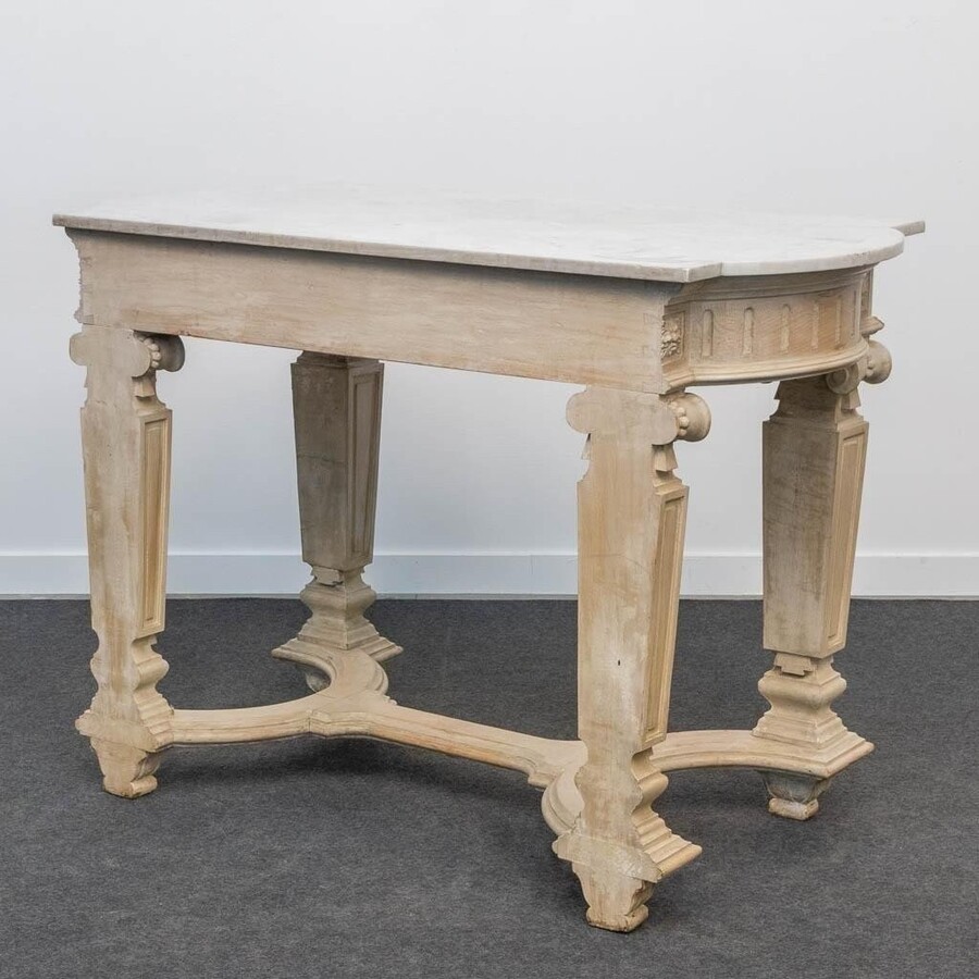 Decorative console of sculpted wood Louis XVI style late 19th century. Model with iconic columns minor damages and crack in marble top. Dimensions : Width: 125 cm Height: 87 cm Depth: 65,5 cm