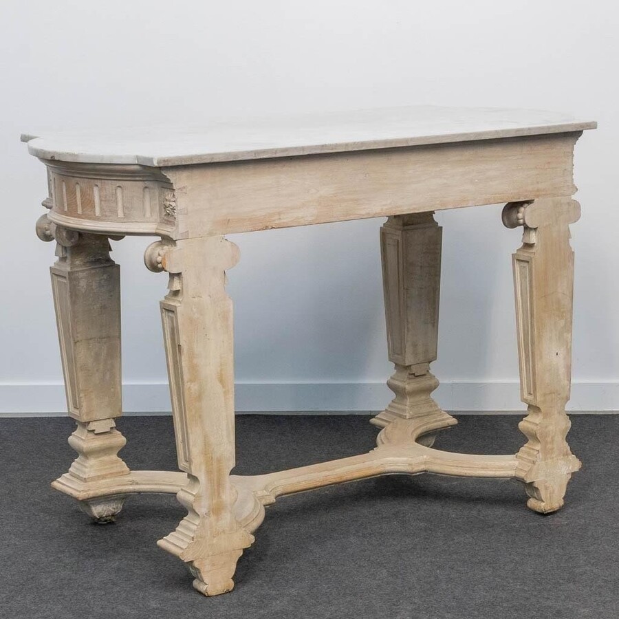 Decorative console of sculpted wood Louis XVI style late 19th century. Model with iconic columns minor damages and crack in marble top. Dimensions : Width: 125 cm Height: 87 cm Depth: 65,5 cm