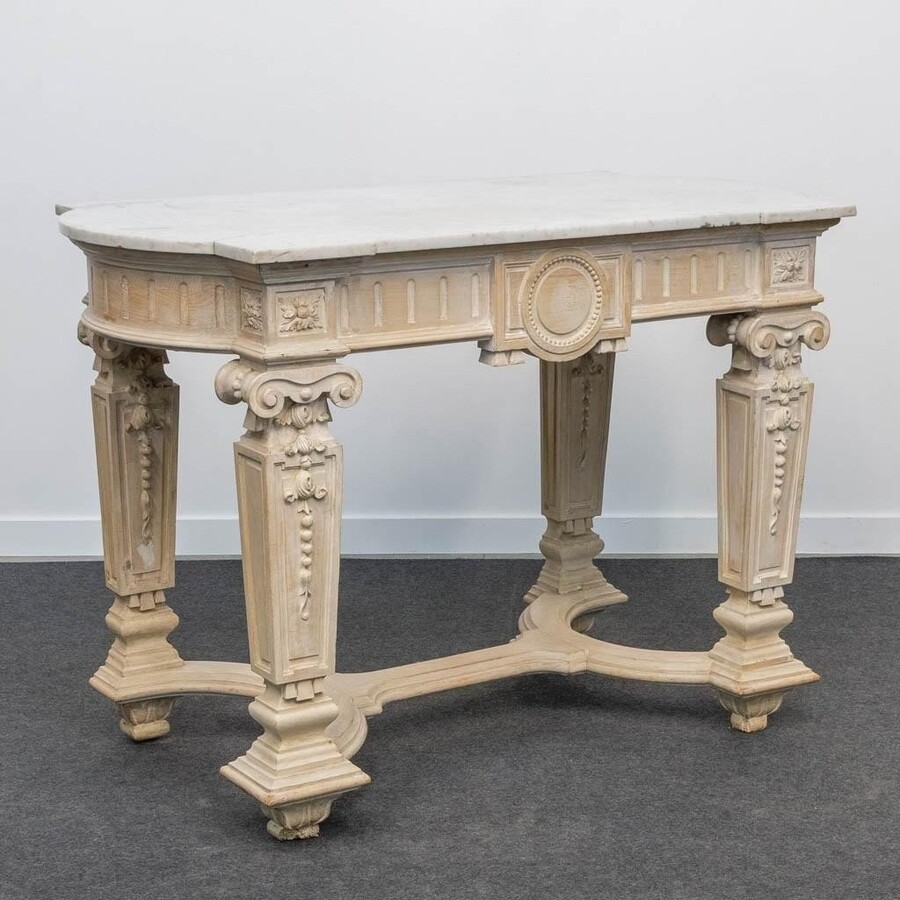 Decorative console of sculpted wood Louis XVI style late 19th century. Model with iconic columns minor damages and crack in marble top. Dimensions : Width: 125 cm Height: 87 cm Depth: 65,5 cm