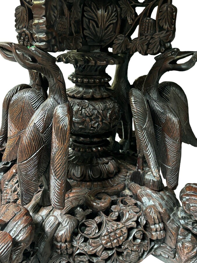 Finely sculpted centre table in hardwood 19th century. Decorated with dragons , birds , animals and temples Folding top , in good condition. Dimensions : Height : 78 cm Diameter top : 84 cm Nice table from Burma , 19thC