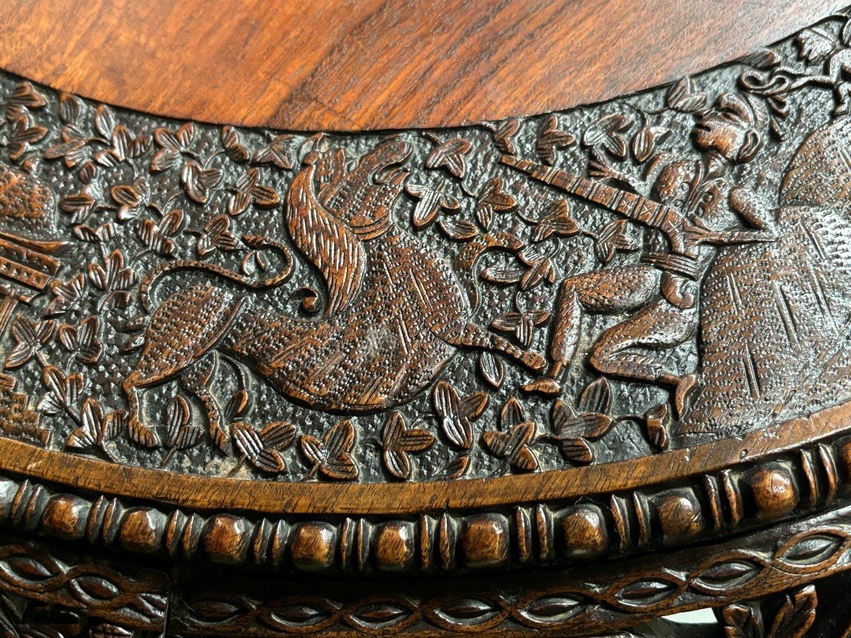 Finely sculpted centre table in hardwood 19th century. Decorated with dragons , birds , animals and temples Folding top , in good condition. Dimensions : Height : 78 cm Diameter top : 84 cm Nice table from Burma , 19thC