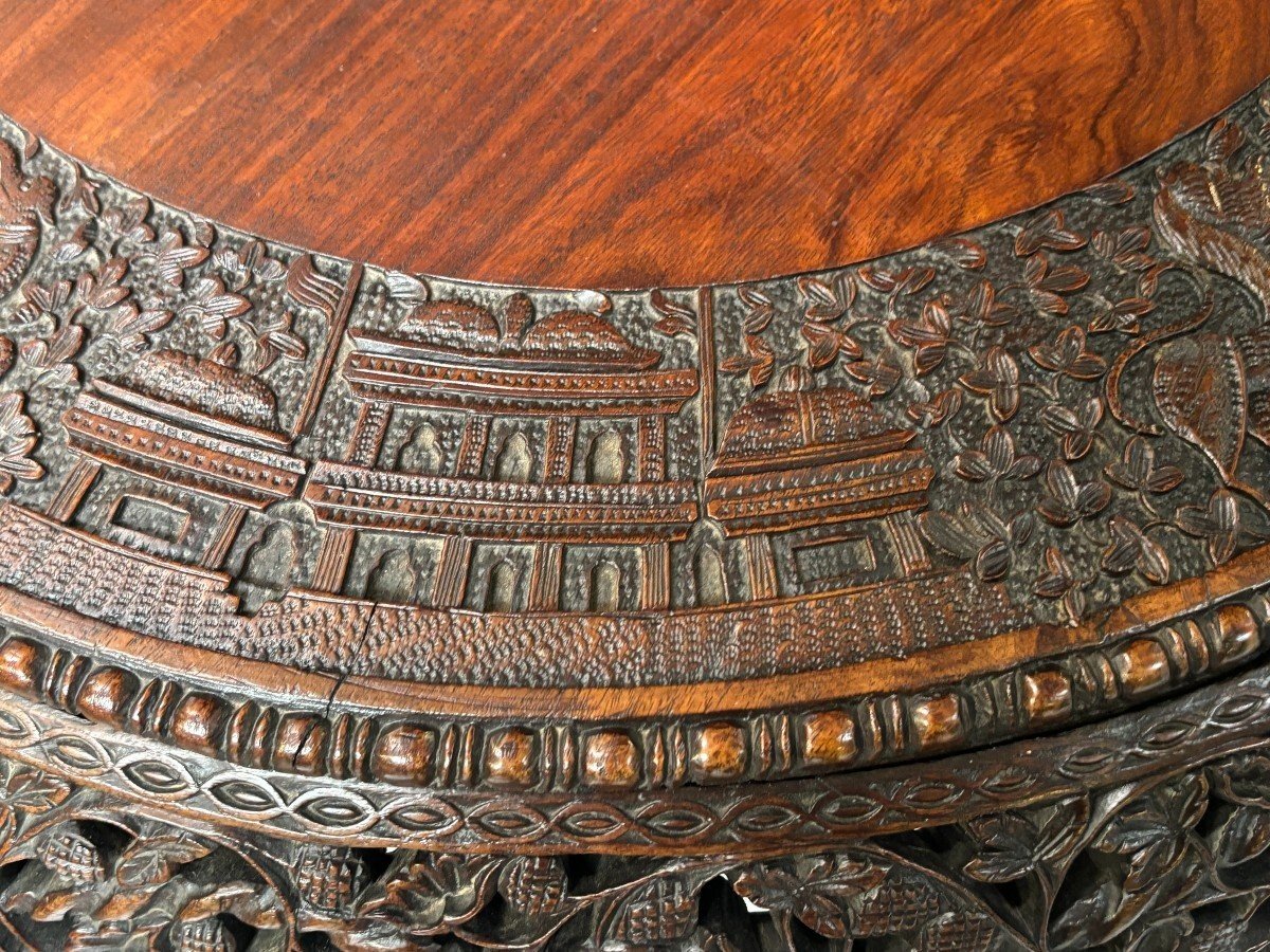 Finely sculpted centre table in hardwood 19th century. Decorated with dragons , birds , animals and temples Folding top , in good condition. Dimensions : Height : 78 cm Diameter top : 84 cm Nice table from Burma , 19thC