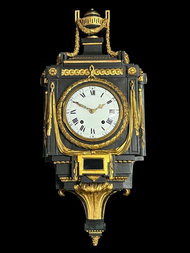 Large 18th century Louis XVI style wooden wall clock ( 78 cm ). Decorative cartel in black and gilded wood with the following dimensions: Height : 78 cm Width : 35 cm Depth : 18 cm. 18th century cartel in good condition with original clock.