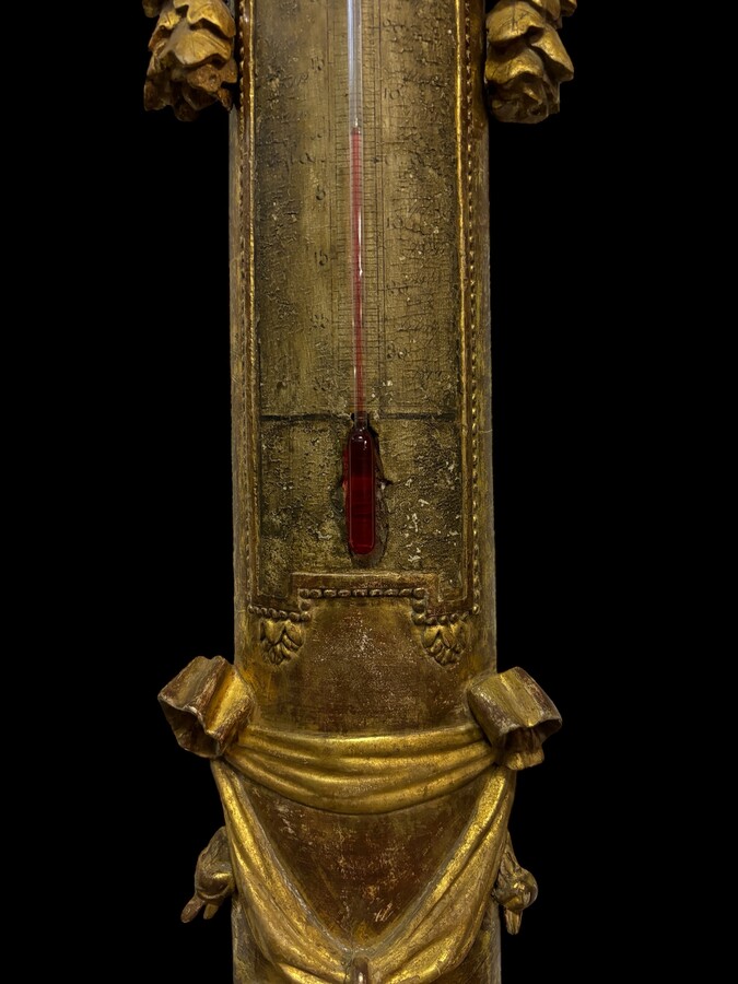 Large Barometer Muret à Paris in gilded wood 18th century Louis Seize decorative barometer in good condition ( cracked glass ) Dimensions : Height : 107 cm Diameter : 25,5 cm Paris, 18th century