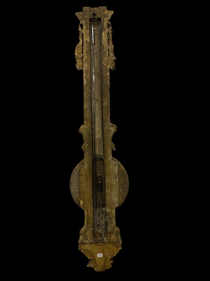 Large Barometer Muret à Paris in gilded wood 18th century Louis Seize decorative barometer in good condition ( cracked glass ) Dimensions : Height : 107 cm Diameter : 25,5 cm Paris, 18th century