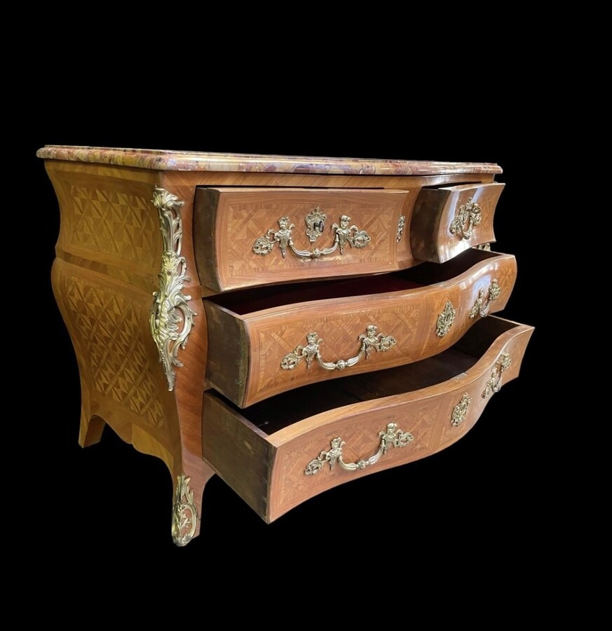 Large commode in Louis XV style 19th century Dresser with parquet veneer, gilt bronze ornaments and fitted with 2 small drawers at the top and 2 large ones below. At the top a beautiful Plateau en Marbre Breche d'Alep. Dimensions : Width : 139 cm 