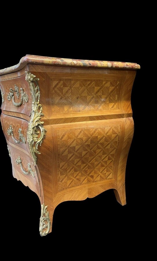 Large commode in Louis XV style 19th century Dresser with parquet veneer, gilt bronze ornaments and fitted with 2 small drawers at the top and 2 large ones below. At the top a beautiful Plateau en Marbre Breche d'Alep. Dimensions : Width : 139 cm 