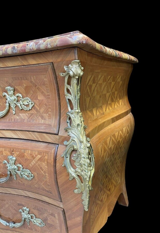 Large commode in Louis XV style 19th century Dresser with parquet veneer, gilt bronze ornaments and fitted with 2 small drawers at the top and 2 large ones below. At the top a beautiful Plateau en Marbre Breche d'Alep. Dimensions : Width : 139 cm 