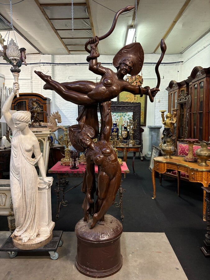 Large decorative wooden sculpture ‘pair of dancers’ early 20th century Special Art Nouveau style wooden sculpture, finely detailed, depicting 2 ladies dancing with 2 snakes standing on a large round wooden base.