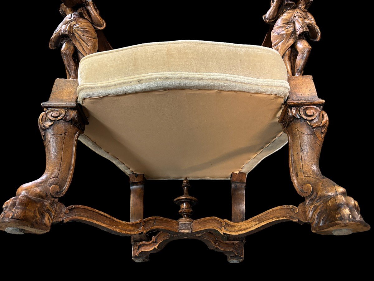 Large Italian armchair in walnut 19thC. Very decorative armchair with finely sculpted people and putti in walnut. Woodwork in good condition , fabric in used condition. Dimensions : Height : 121 cm Width : 86 cm Depth : 78 cm Italy , around 1860-1870