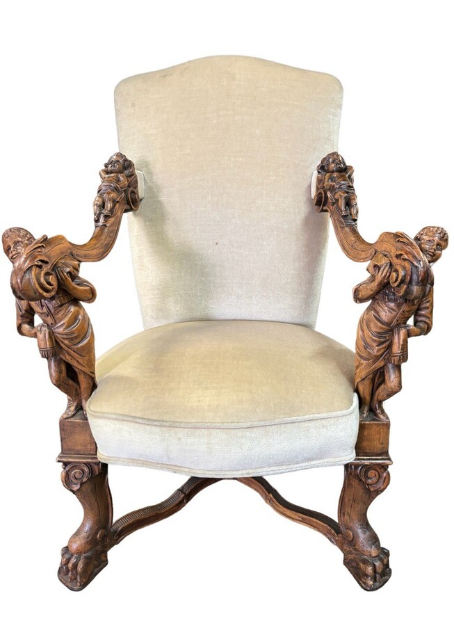 Large Italian armchair in walnut 19thC. Very decorative armchair with finely sculpted people and putti in walnut. Woodwork in good condition , fabric in used condition. Dimensions : Height : 121 cm Width : 86 cm Depth : 78 cm Italy , around 1860-1870