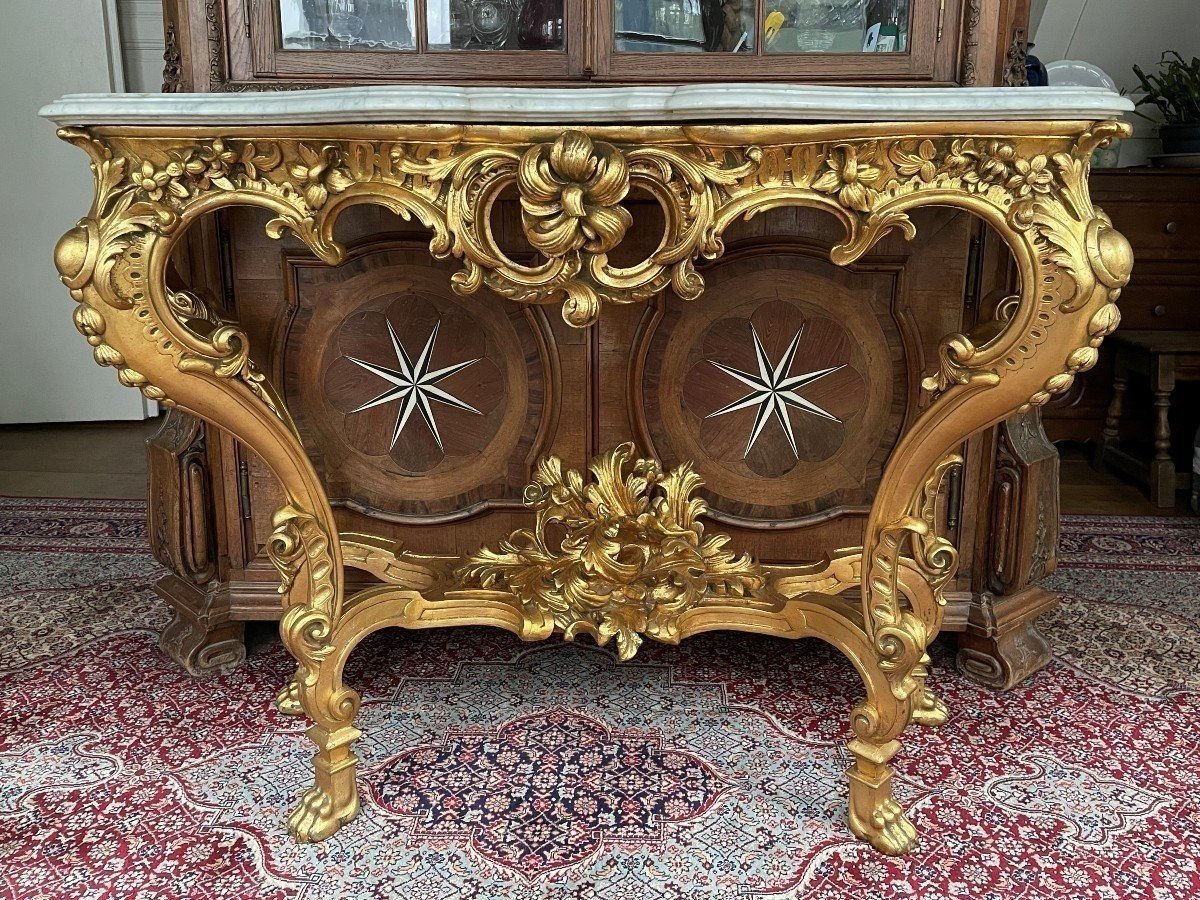 Large Louis XV style 4 legs console in gilded wood/stucco 19th century. Decorative console with a nice thick white marble top. The console and the marble top are in good condition and stand on 4 claw feet. It dates from about 1880-1900.