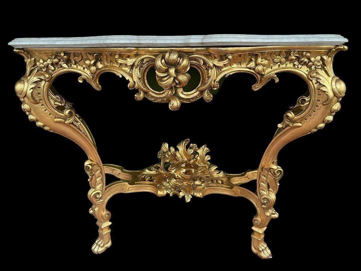 Large Louis XV style 4 legs console in gilded wood/stucco 19th century. Decorative console with a nice thick white marble top. The console and the marble top are in good condition and stand on 4 claw feet. It dates from about 1880-1900.