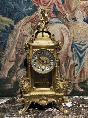 Large pendulum clock in gilt bronze with cut glass 19th century. Representation of Chronos figure , winged Mythological beasts and decorations in bronze working with a suns balance. Richly decorated dial signed R.COTTIN.26 Rue Amelot PARIS