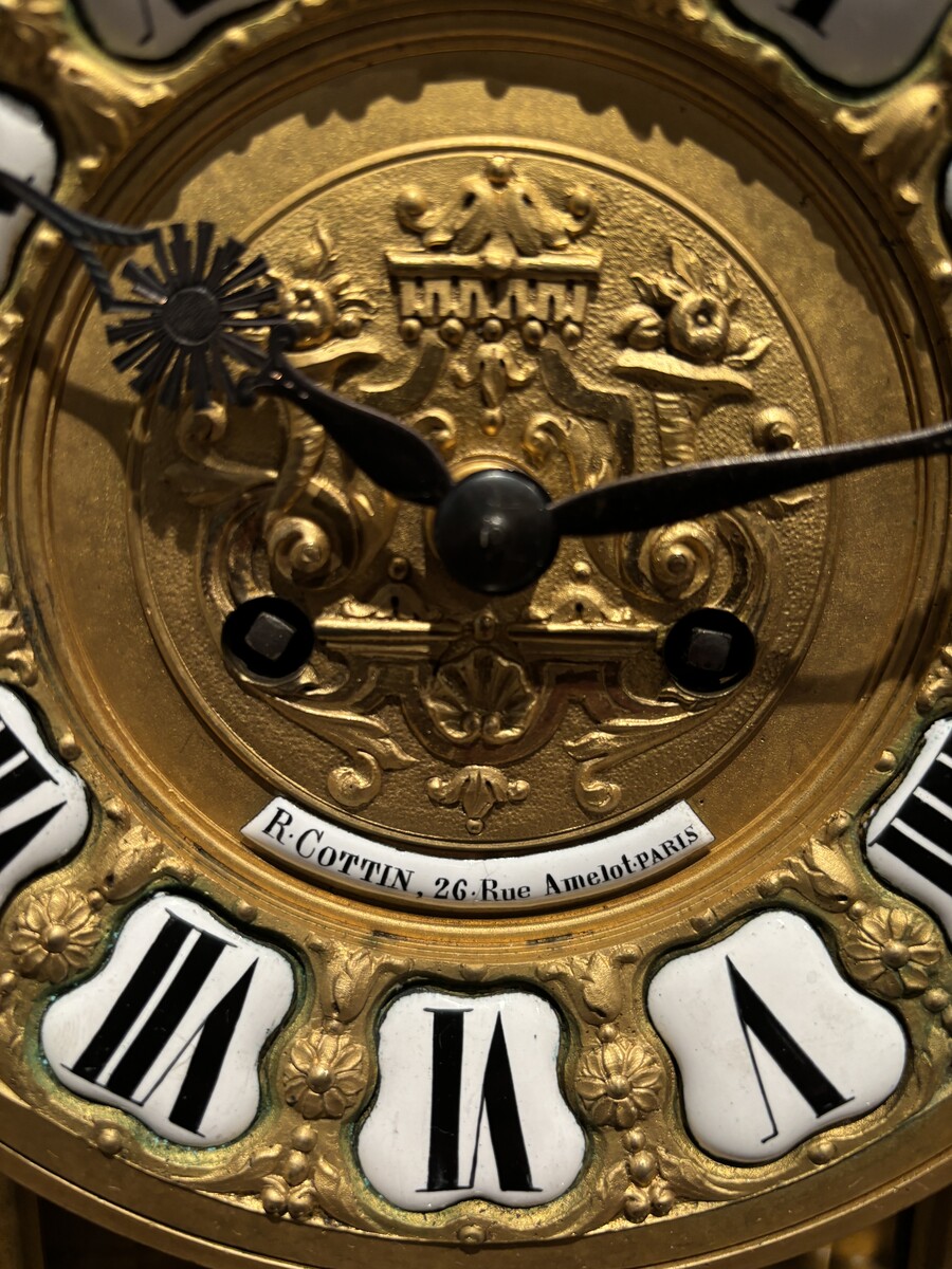 Large pendulum clock in gilt bronze with cut glass 19th century. Representation of Chronos figure , winged Mythological beasts and decorations in bronze working with a suns balance. Richly decorated dial signed R.COTTIN.26 Rue Amelot PARIS